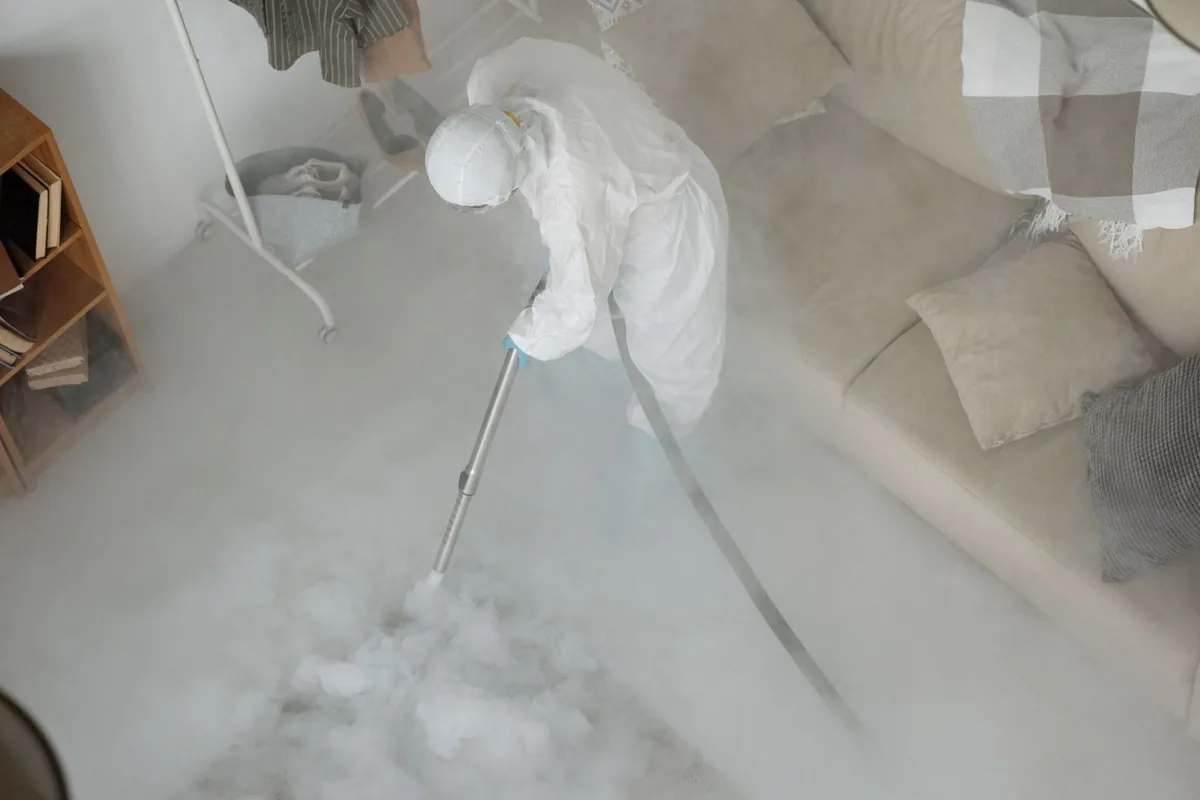 Biohazard cleanup technician in protective equipment, Buna, TX